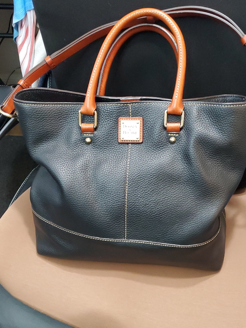 Dooney & Bourke Chelsea Shopper Slate Tote with Brown Trim and Handles.